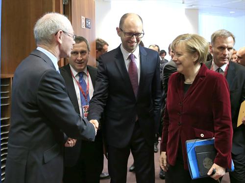 Extraordinary meeting of EU heads of state or Government on Ukraine. Russels. (from left to right) Herman Van Rompuy, President of the European Council shakes hands with Arseniy Yatseniuk, Prime Minister of Ukraine in the presence of Angela Merkel , German Federal Chancellor. (Council of the European Union photographic library, 6.3.2014).
