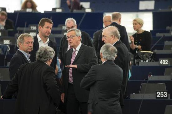 Jean-Claude Juncker, President of the European Commission (in the middle of a group of MEPs), and several Members of the College of the Commission participated in the European Parliament plenary session which focused on the presentation of the creation of a new EU strategic investment plan. (EC Audiovisual Services, 26/11/2014).